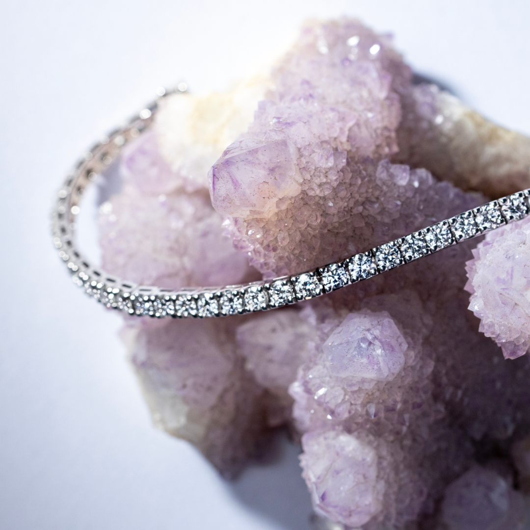 White Gold Tennis Bracelets on a crystal rock background